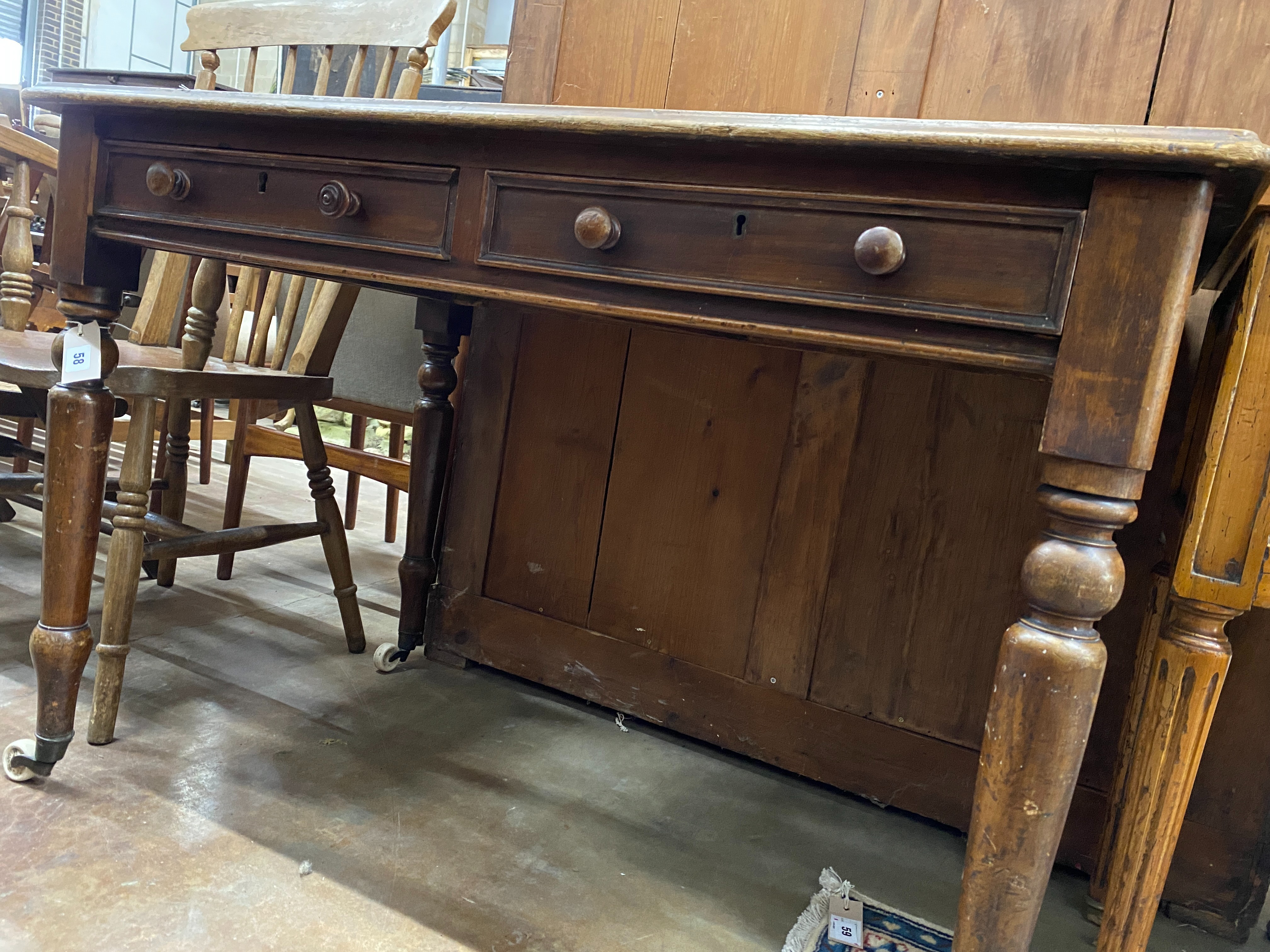 A Victorian mahogany two drawer writing table, width 106cm, depth 68cm, height 73cm